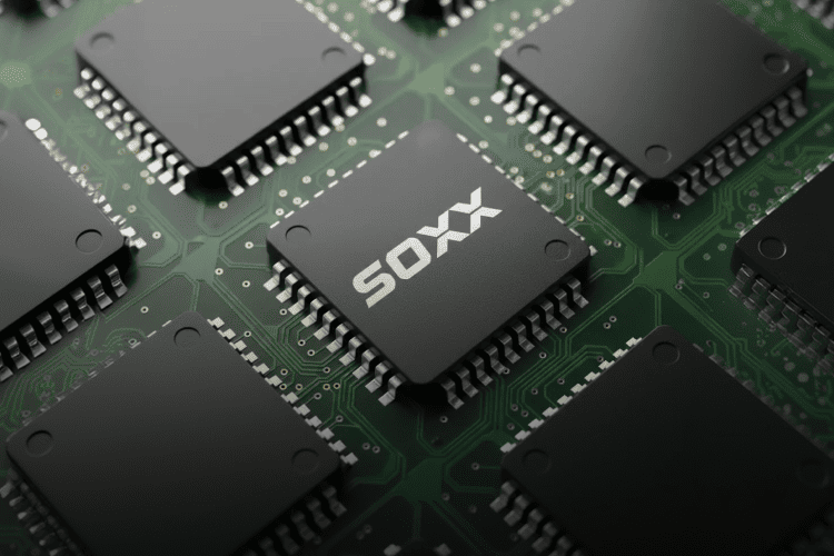 SOXX semiconductor ETF illustration – black chip with SOXX marking on a green circuit board.