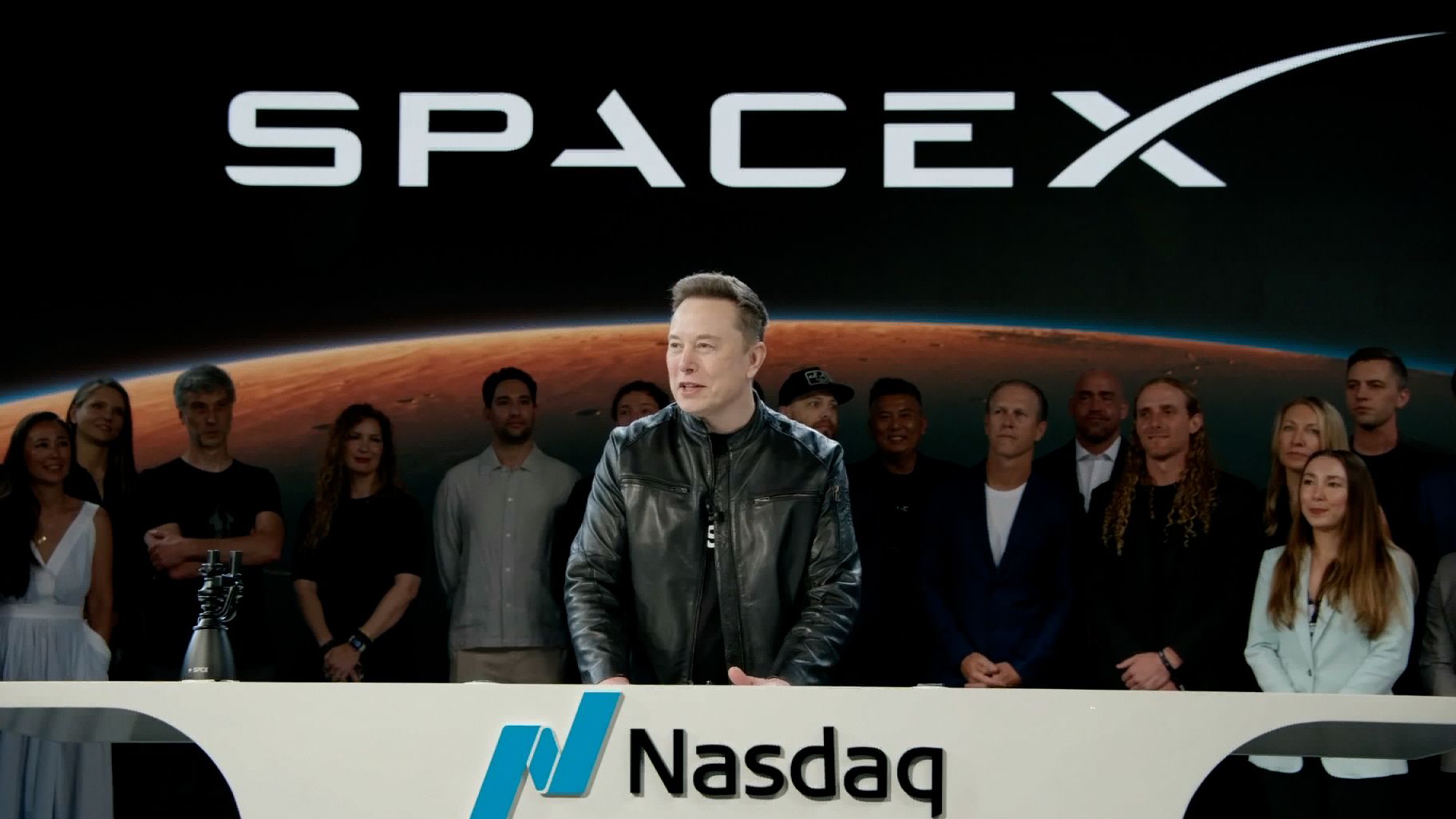 Elon Musk speaks to the SpaceX team during Nasdaq’s opening bell ceremony for the company’s IPO debut.