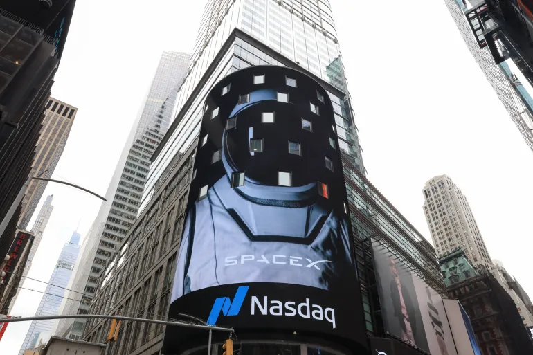 Nasdaq MarketSite screen in New York showing SpaceX during the company’s public market debut after the IPO.