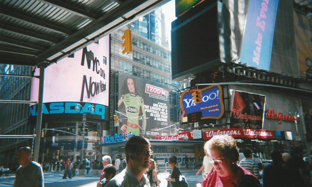 Nasdaq MarketSite in Times Square, New York, with electronic displays and pedestrians.