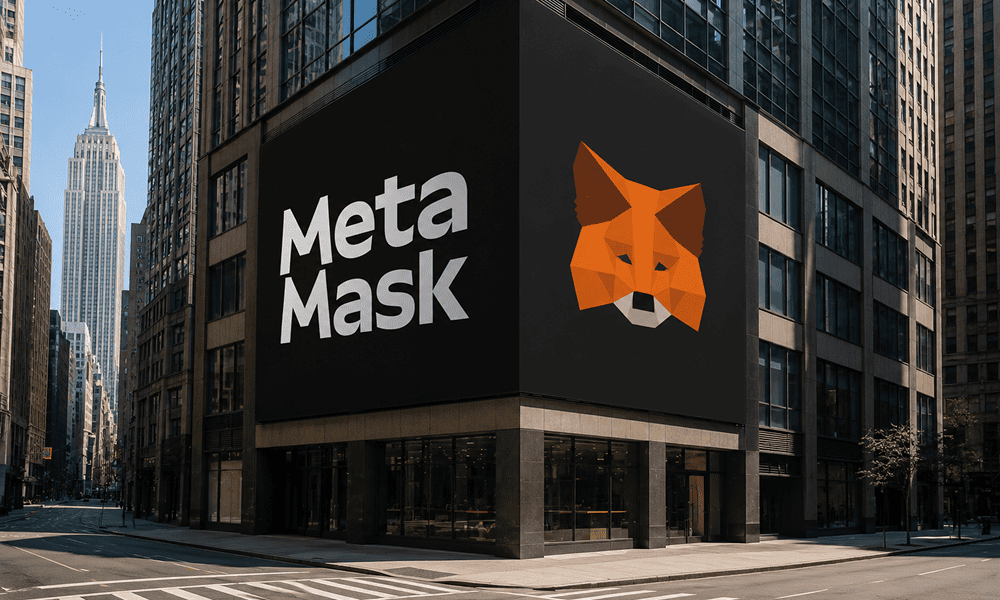 The MetaMask logo and iconic fox displayed on digital screens across the facade of a building in New York