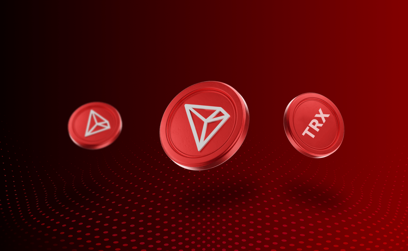 3D-иллюстрация токенов TRX с логотипом TRON на красном цифровом фоне.