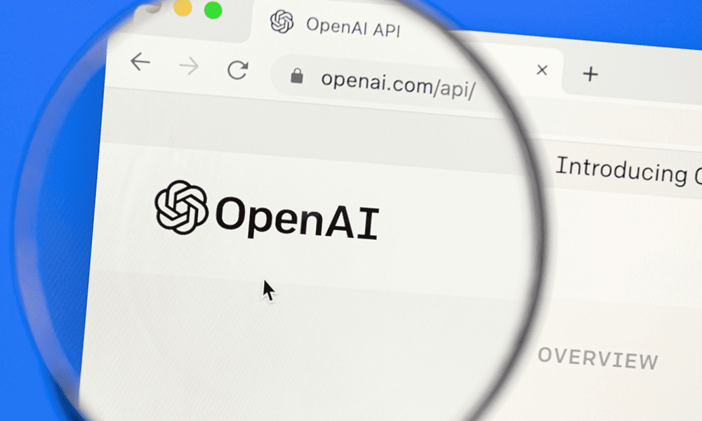 Логотип OpenAI на странице API, увеличенный через лупу в окне браузера.