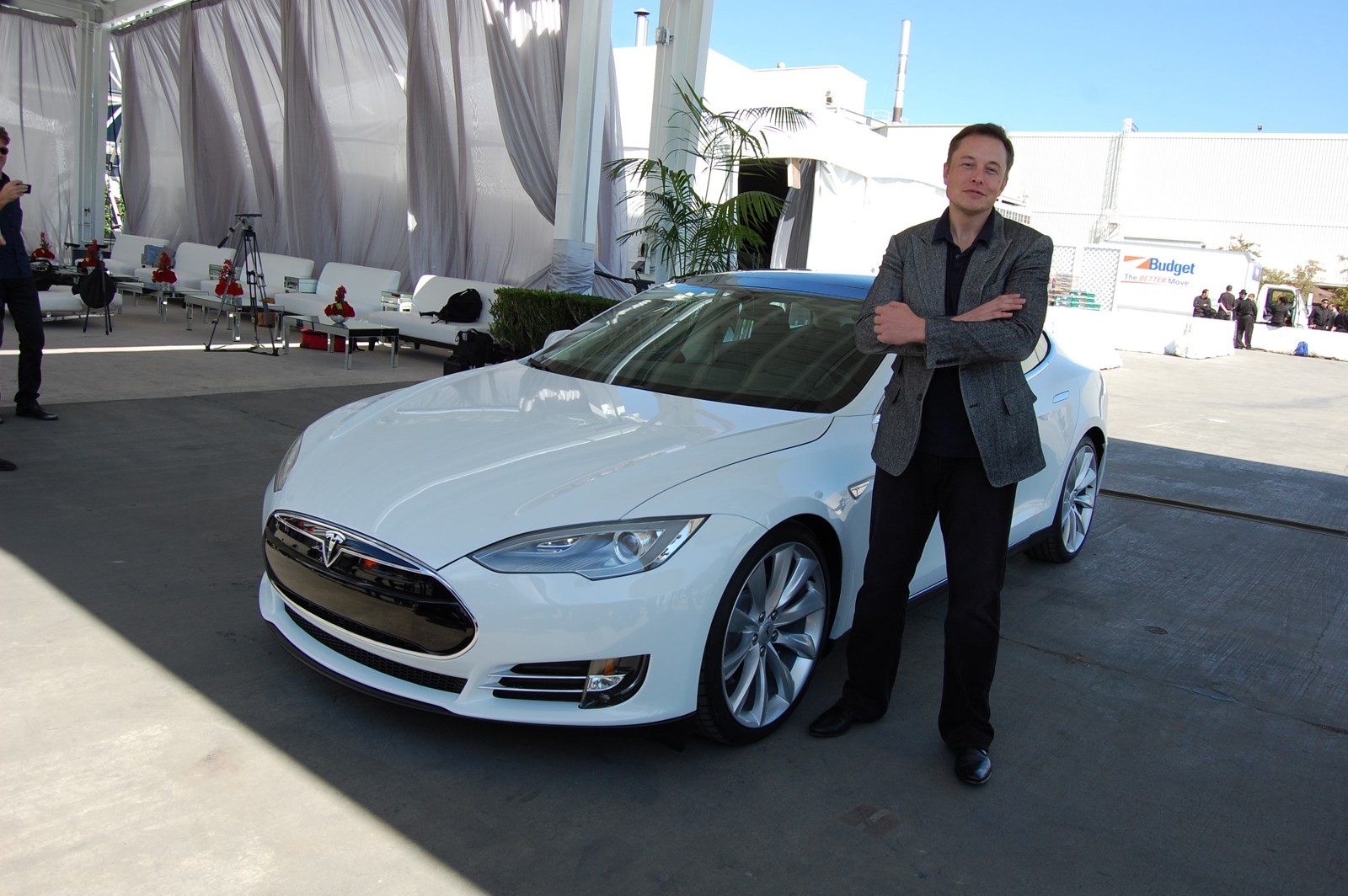 Photo: Maurizio Pesce. CC BY 2.0: https://creativecommons.org/licenses/by/2.0/ Elon Musk beside a white Tesla Model S at the company’s factory in Fremont.