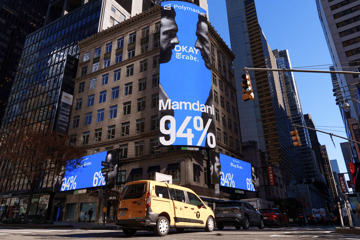Polymarket billboard in New York: "Mamdani 94%" with the tagline "Okay. Trade."